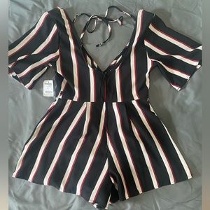 Small, red, white, & blue romper, with open back.